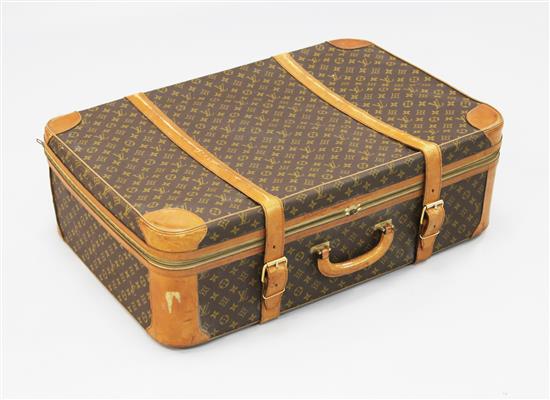 A Louis Vuitton brown leather bound suitcase, 31.5in.